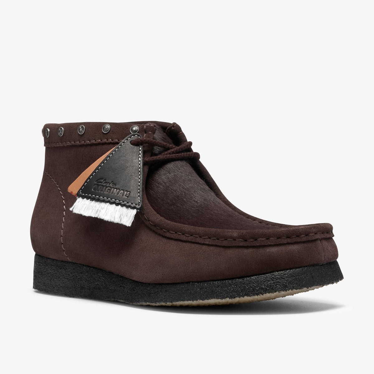 Clarks Wallabee Boot in Brown Interest, front angle with hair-on vamp, studded collar and black crepe sole