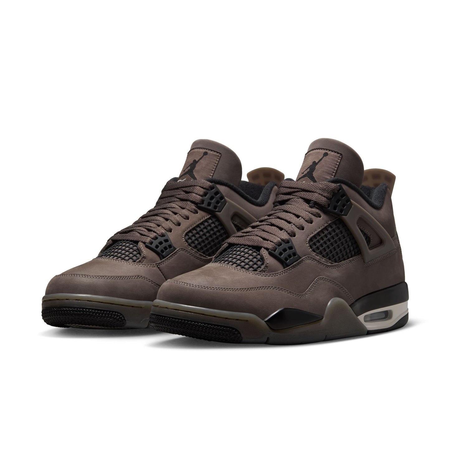Pair of brownish Grey Air Jordan 4 retro sneakers with a white background