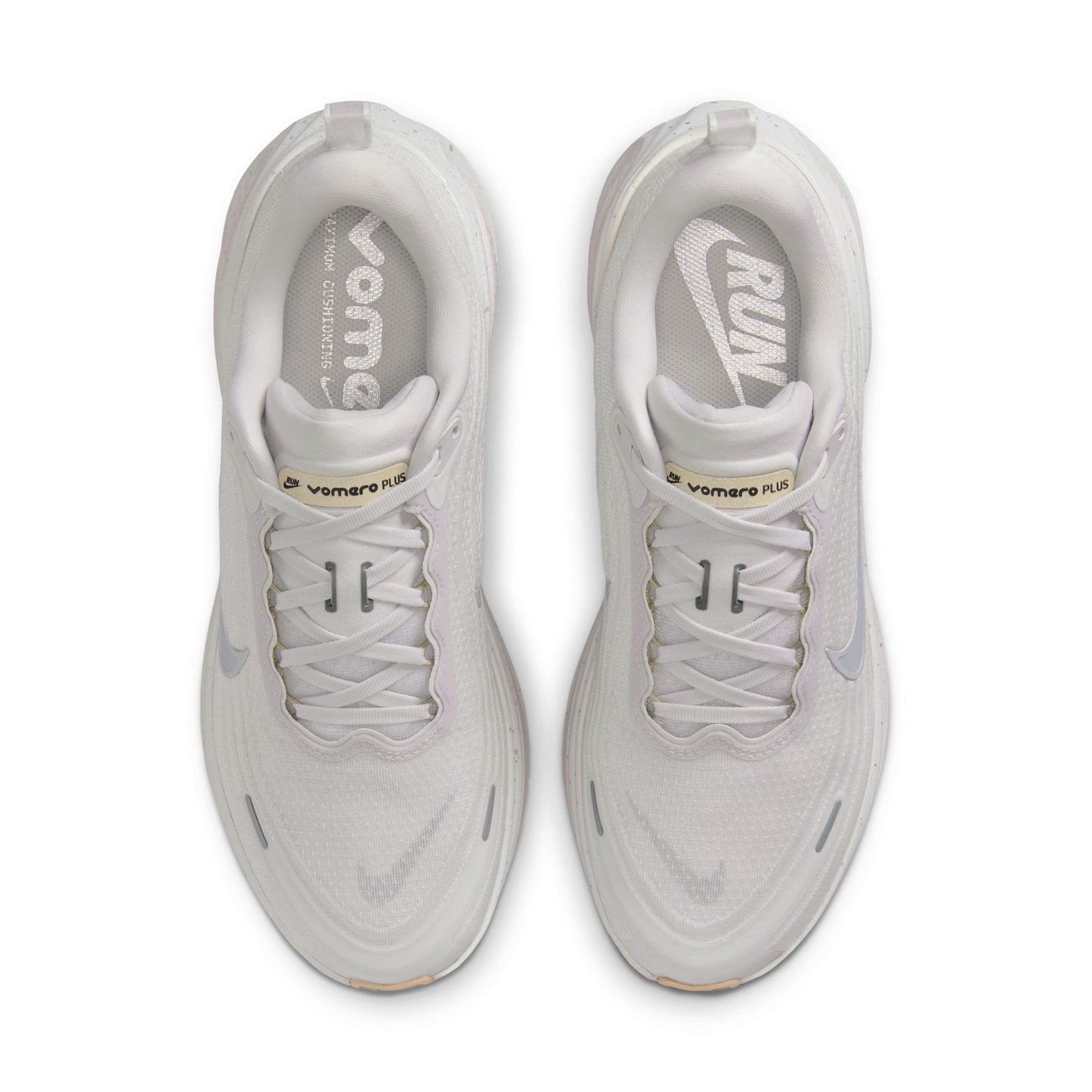 Pair of white sneakers with visible brand logo on a white background