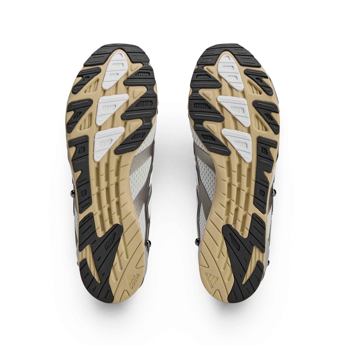 Close-up of a pair of hiking shoes with tread pattern on a white background