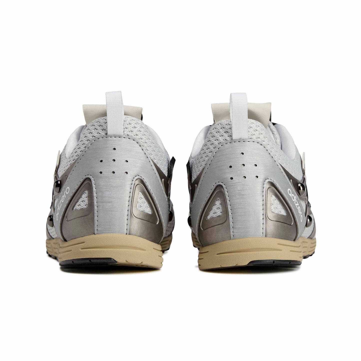 Pair of gray and beige athletic shoes on a white background
