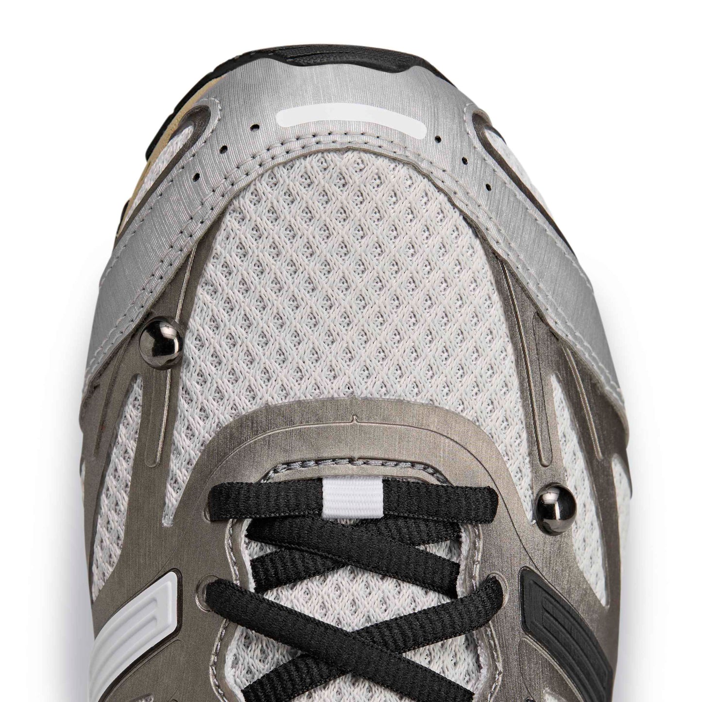 Close-up of a gray athletic shoe with black laces on a white background