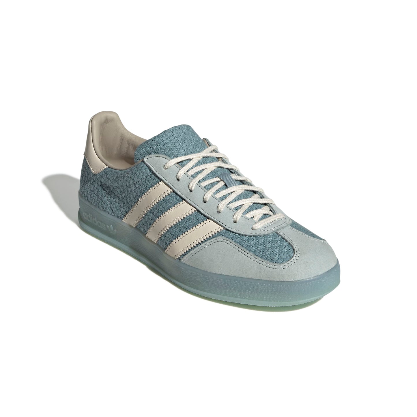 Sky Blue and gray sneaker with white stripes on a white background