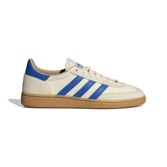 Beige sneaker with blue stripes on a white background