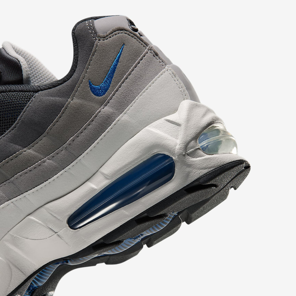 Nike Air Max 95 Big Bubble close-up of heel with Blue Spark Air unit, swoosh and graded gray suede panels