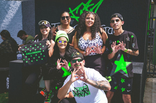 A crew throwing up the Ferxxo hands at the Green Star wall at Shoe Gallery