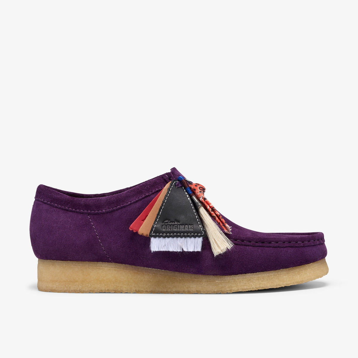 Clarks Wallabee side view in Damson Suede with multicolor tassels, black leather tag and gum crepe sole