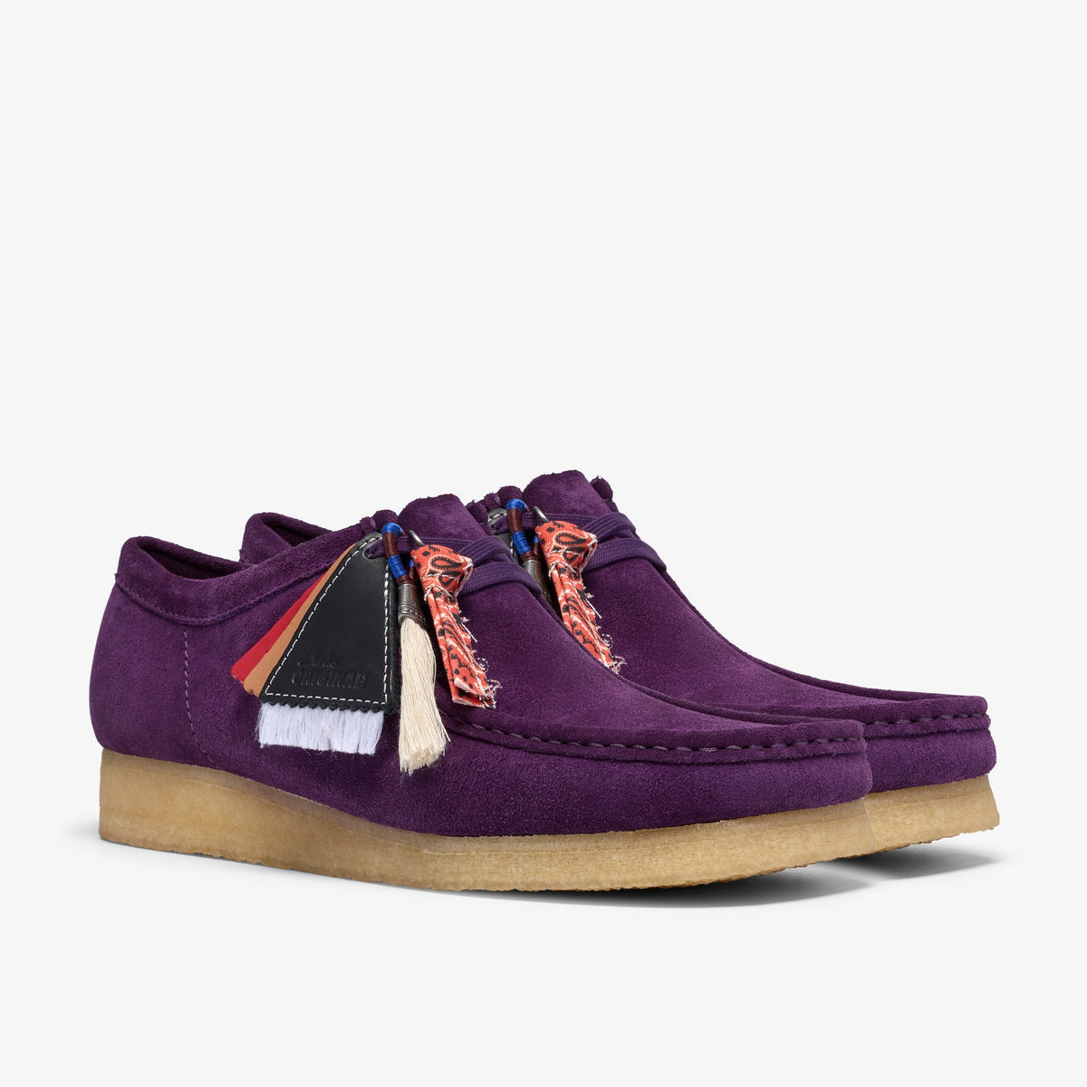 Clarks Wallabee pair in Damson Suede with crepe soles, bandana-print lace ties, tassels and black leather tag