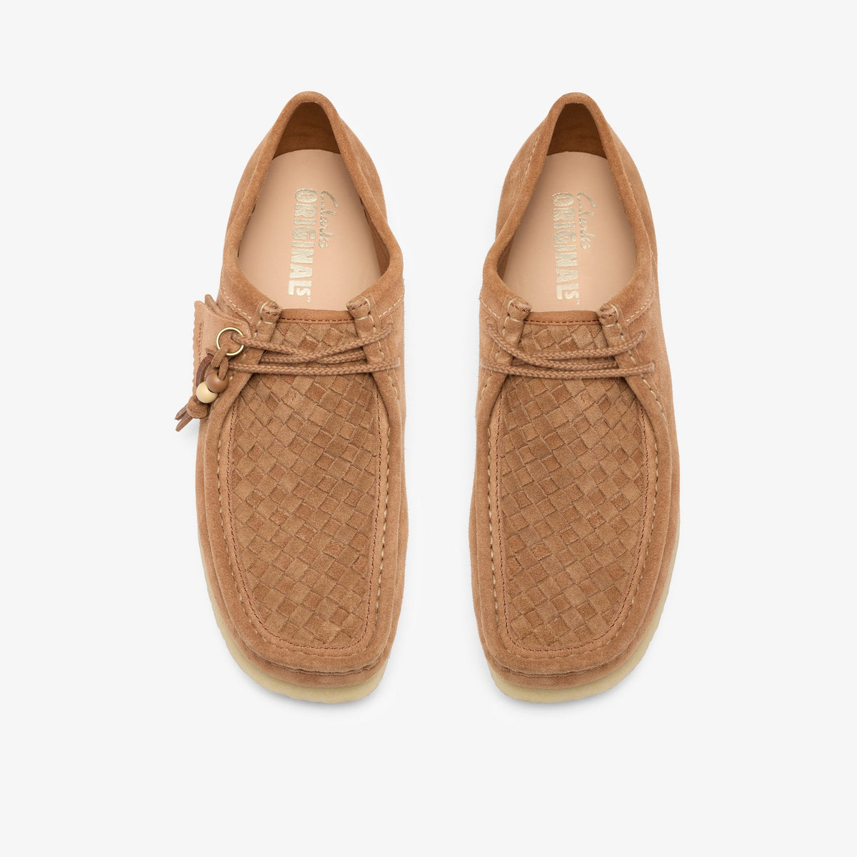Clarks Wallabee in Tan Weave, top view of pair showing woven suede vamps, crepe soles and Clarks Originals insoles