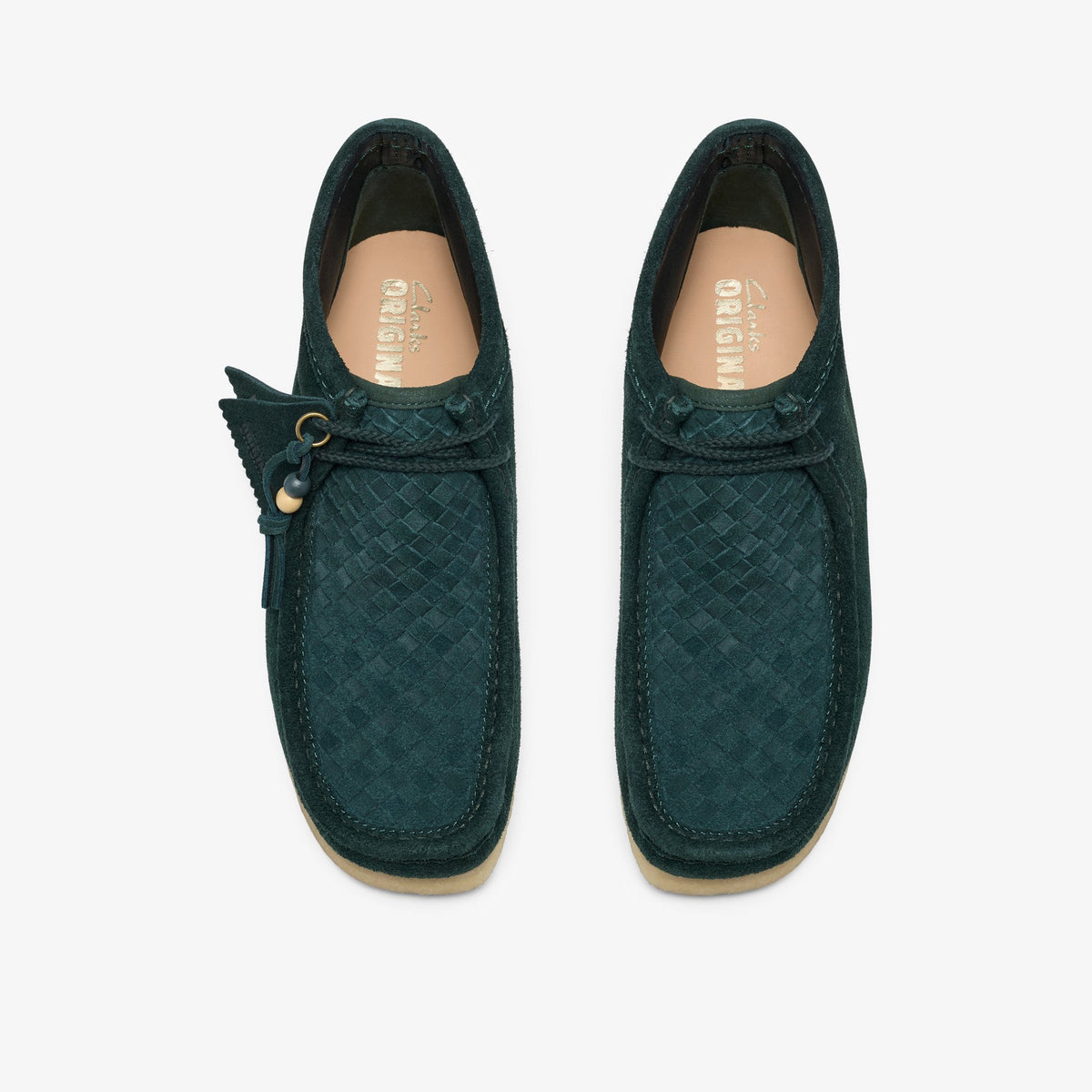 Clarks Wallabee Boot in Forest Green Weave, top view of pair with woven suede toes, tan insoles, and leather tag