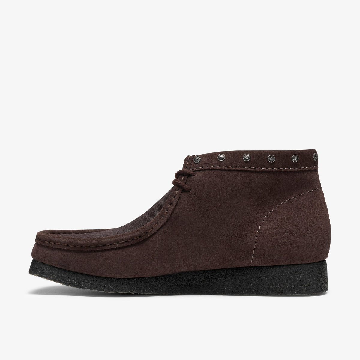 Clarks Wallabee Boot in Brown Interest, side view with brown suede, metal studs at collar and black crepe sole