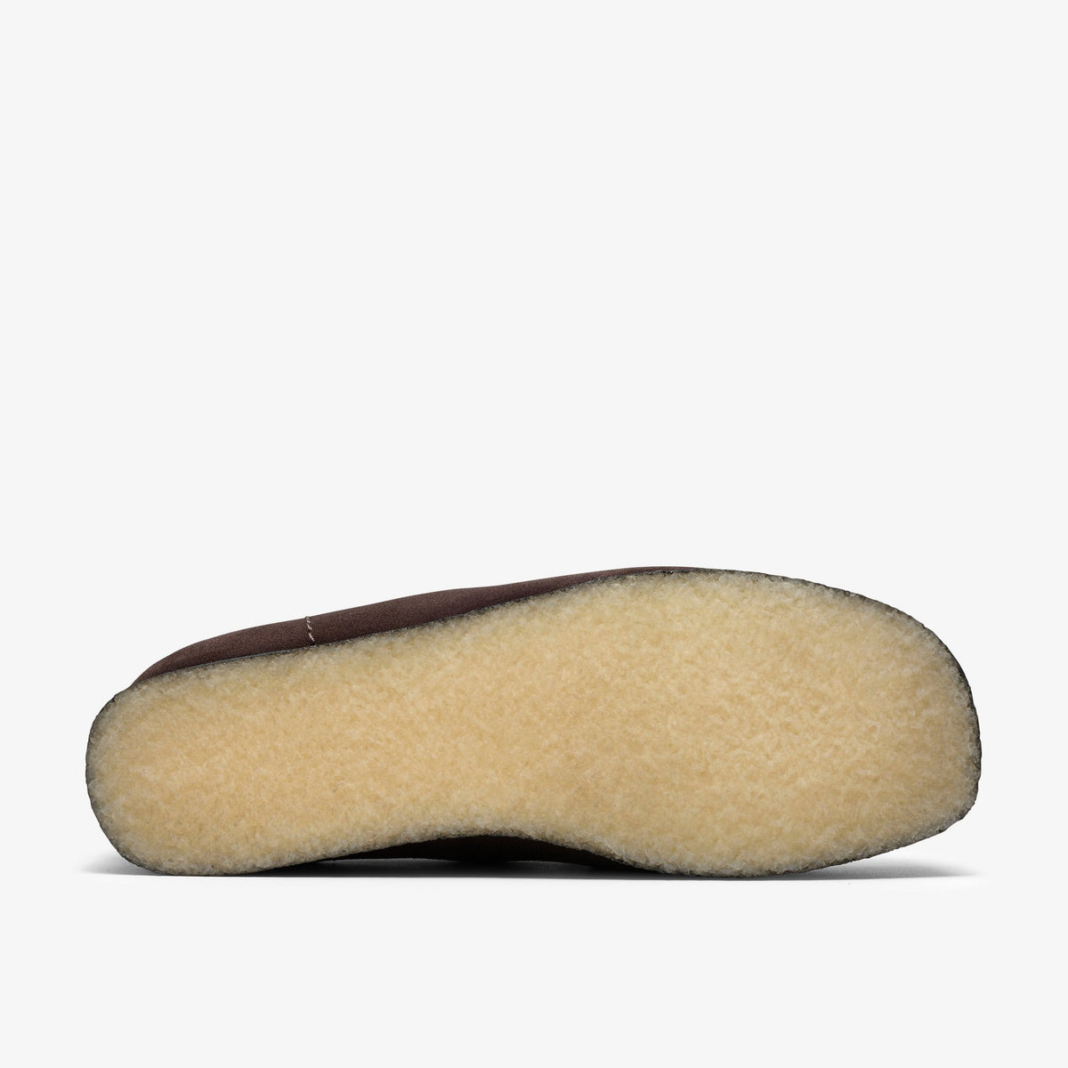 Clarks Wallabee Boot sole view showing natural crepe rubber outsole with brown suede upper edges