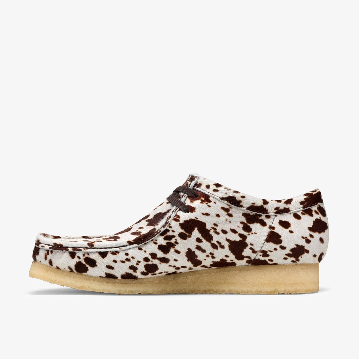 Clarks Wallabee side view in Brown Cow Print hair-on upper with brown laces and natural crepe sole