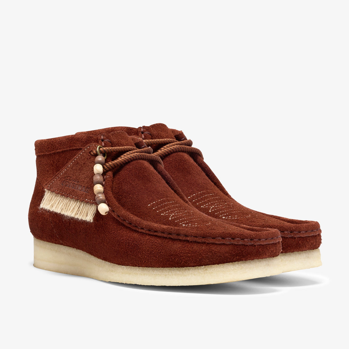 Clarks Wallabee Boot pair in Brown Combination Suede with fringe trim, wooden bead lace charm and stitched toe