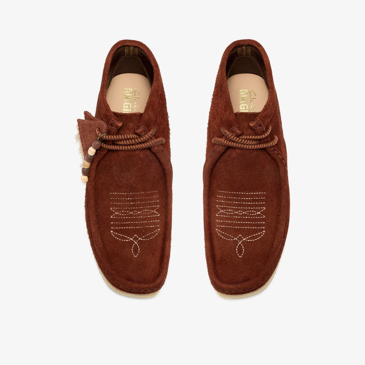 Clarks Originals Wallabee Boot pair top view in Brown Combination Suede with white western stitching and bead charm