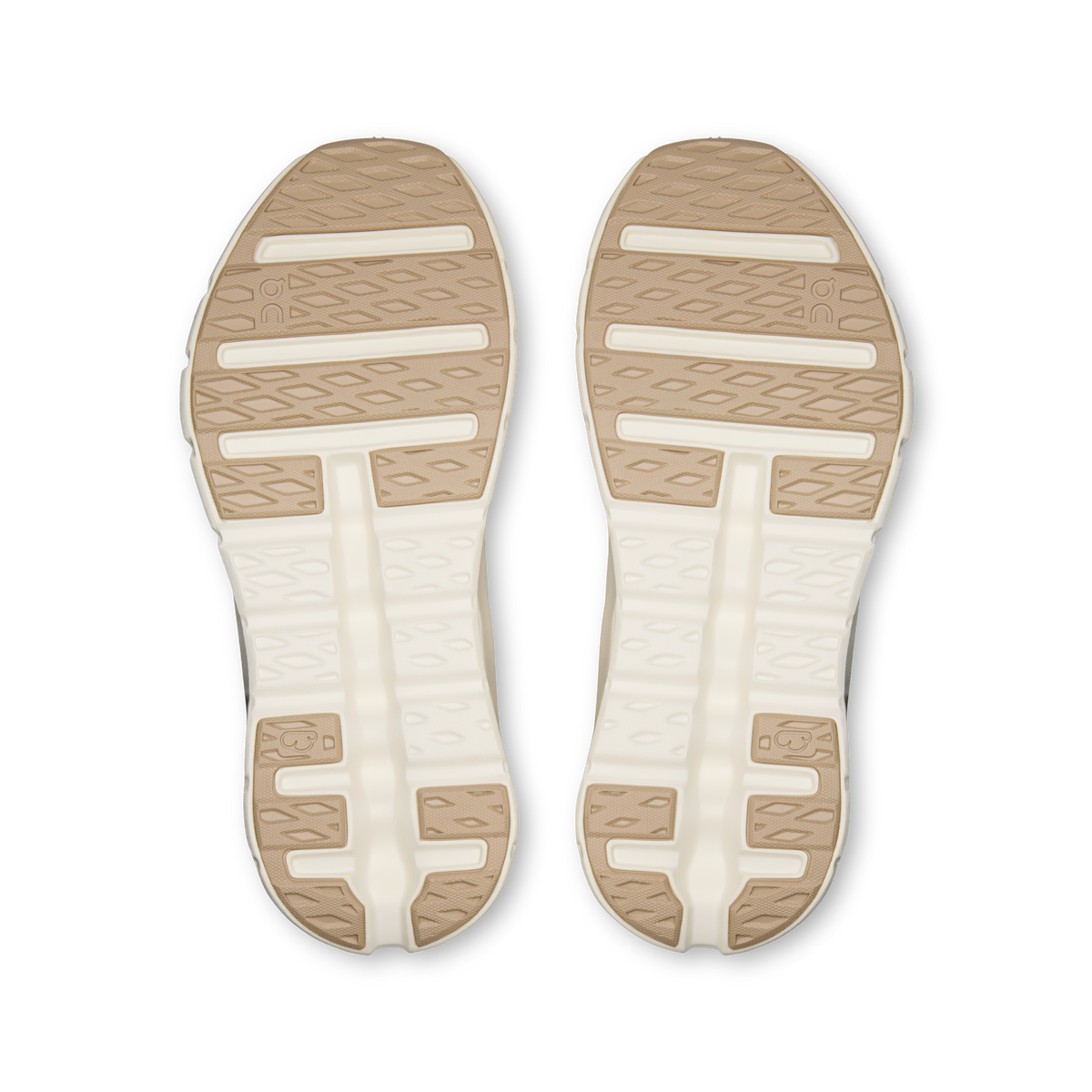 On Cloudtilt Arc sole view of the pair, tan rubber outsole pads with diamond tread over an ivory midsole