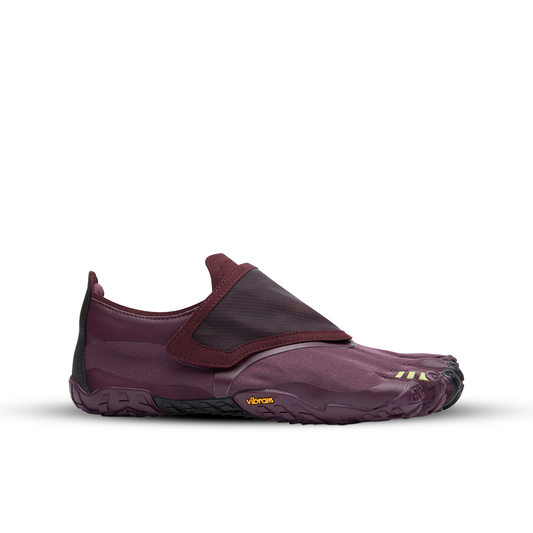 Purple barefoot shoe with a strap on a white background
