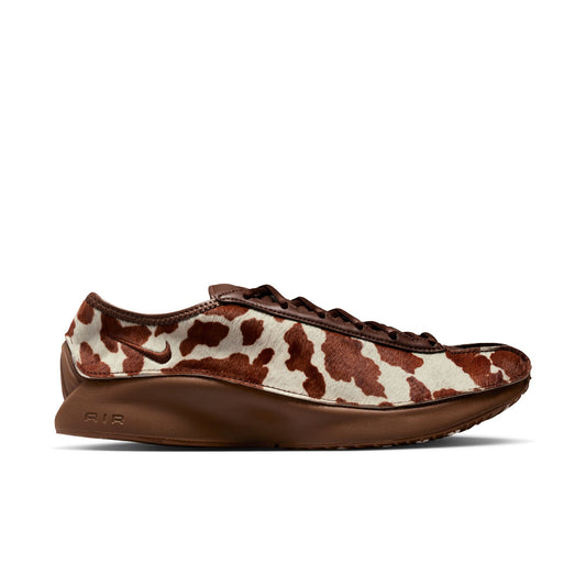 Brown and white cow print sneaker on a white background
