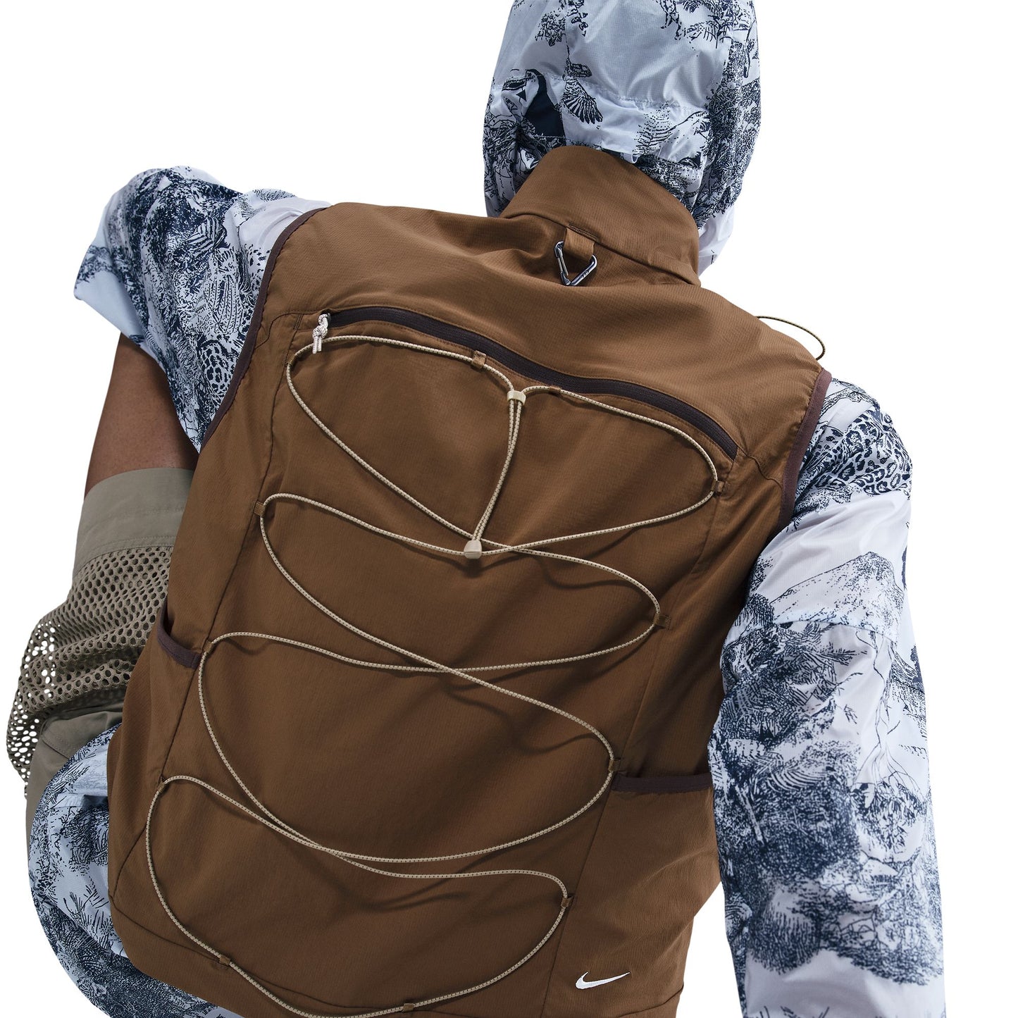 Brown vest worn by a person with a white background