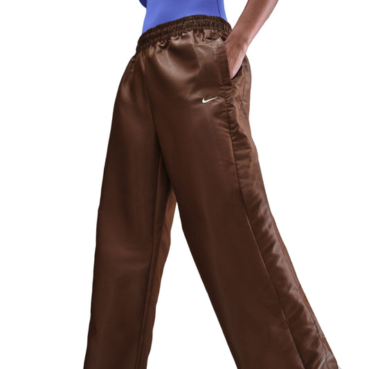 Brown pants with a Nike logo on a dark gray background