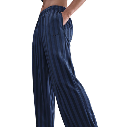 Navy striped pants worn by a person on a white background