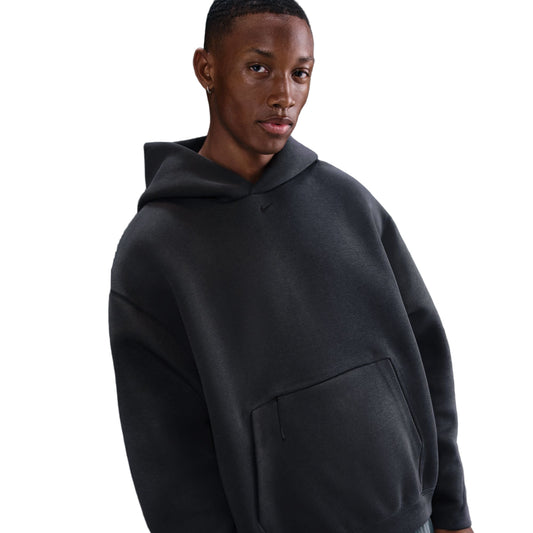 Man wearing a black hoodie on a white background