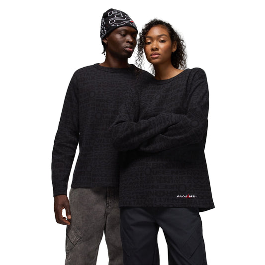 Two people wearing matching black thermals against a white background