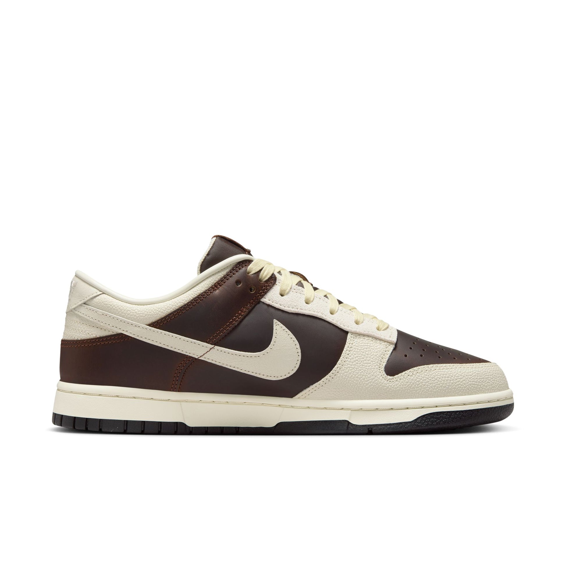 Nike Dunk Low with brown and beige design on a white background