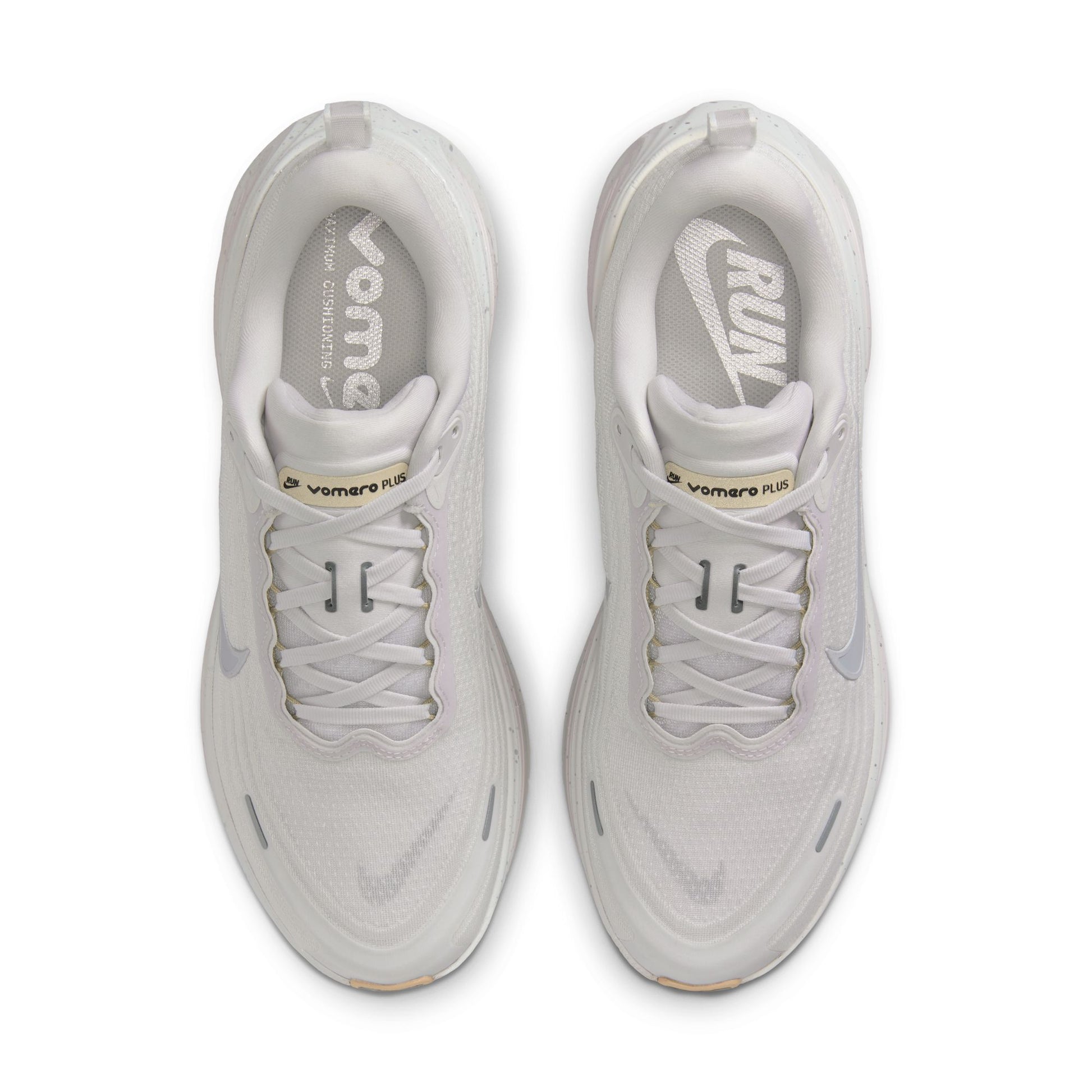 Pair of white sneakers with visible brand logo on a white background