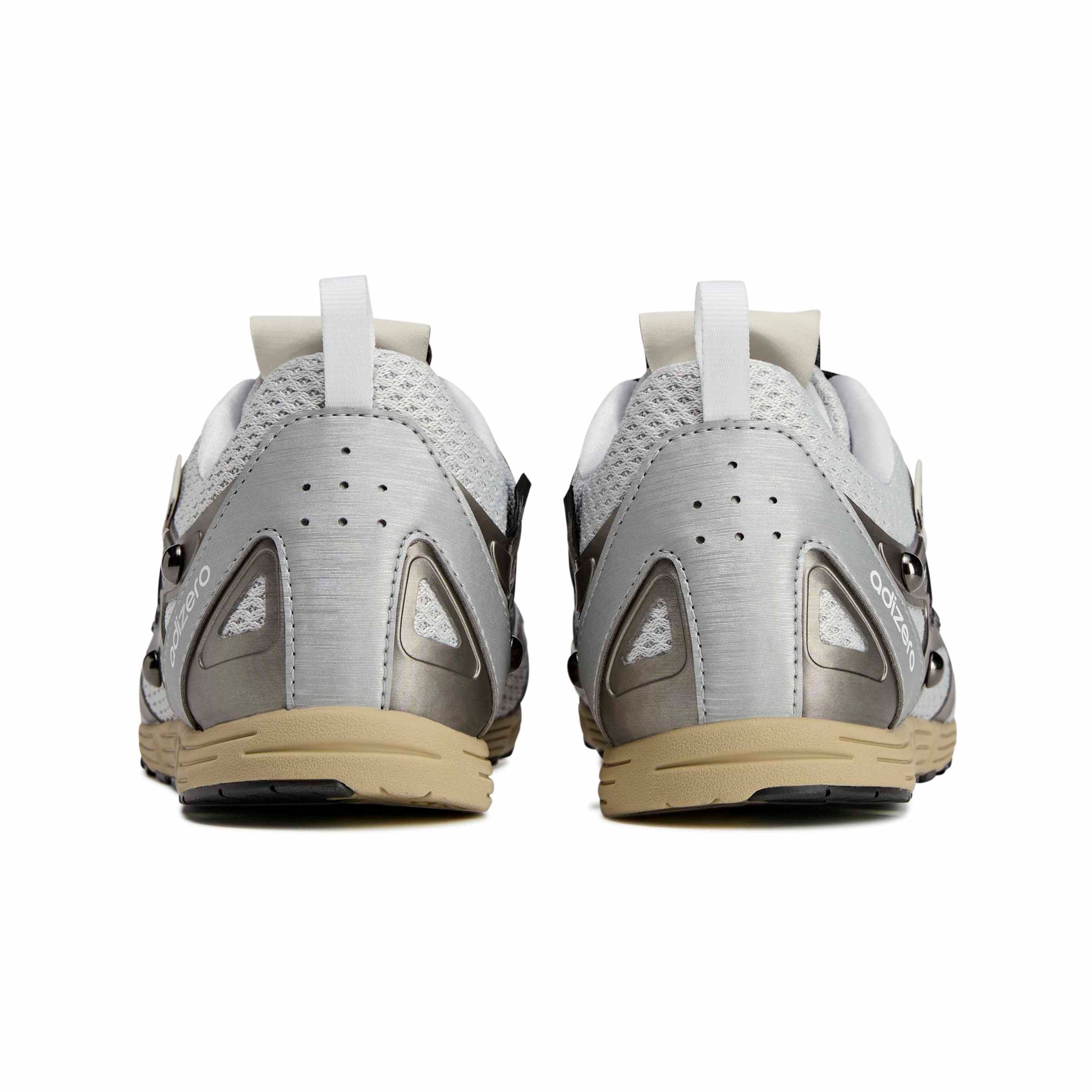 Pair of gray and beige athletic shoes on a white background