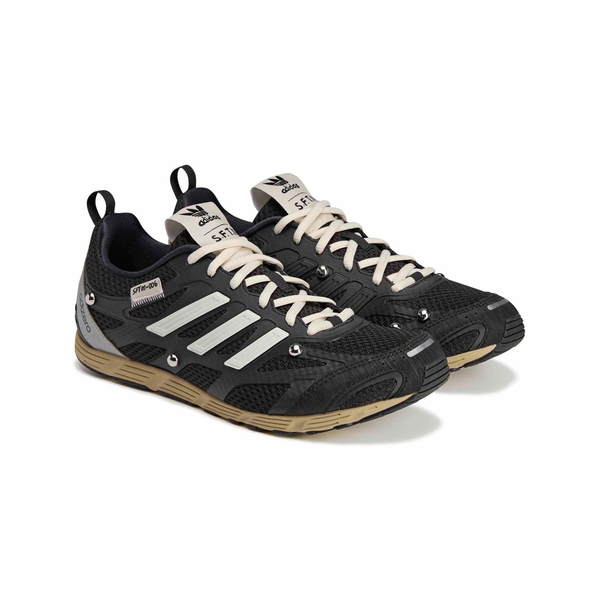 Black and white athletic shoes with visible branding on a white background
