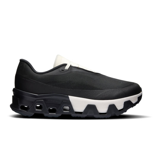Black sneaker with white sole on a white background