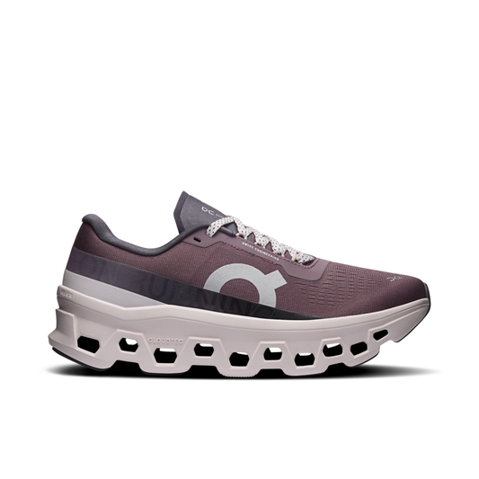 Purple running shoe with white sole on a white background