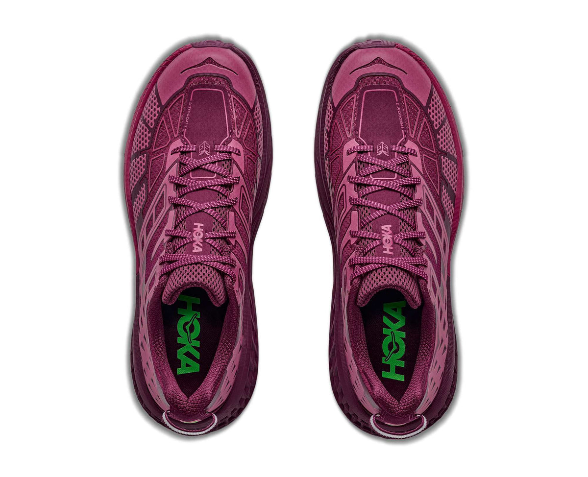 HOKA Speedgoat 2 TS top view of pair in Pink Punch/Cherry Syrup with mesh uppers and green HOKA insole logos