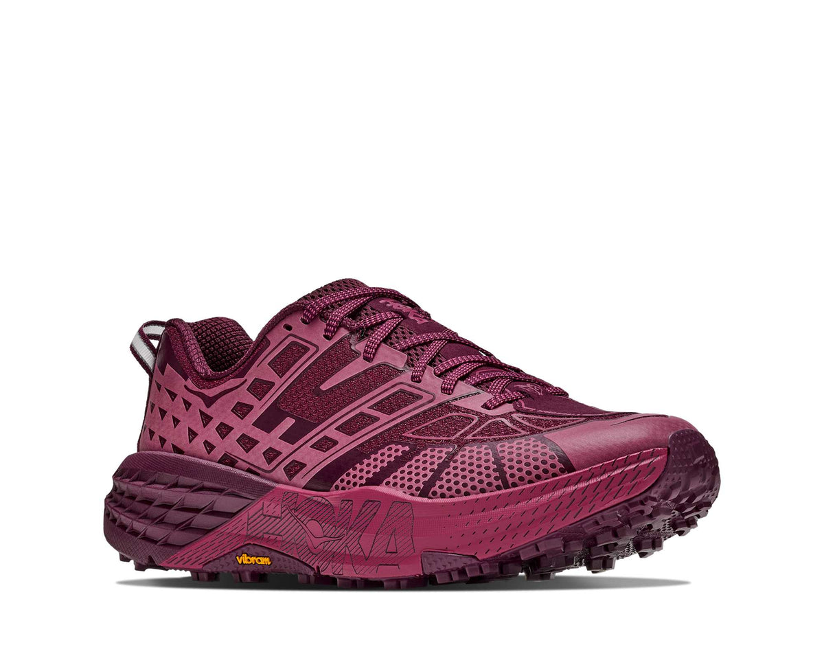 HOKA Speedgoat 2 TS in Pink Punch/Cherry Syrup, angled side view with cage overlays and Vibram lug sole
