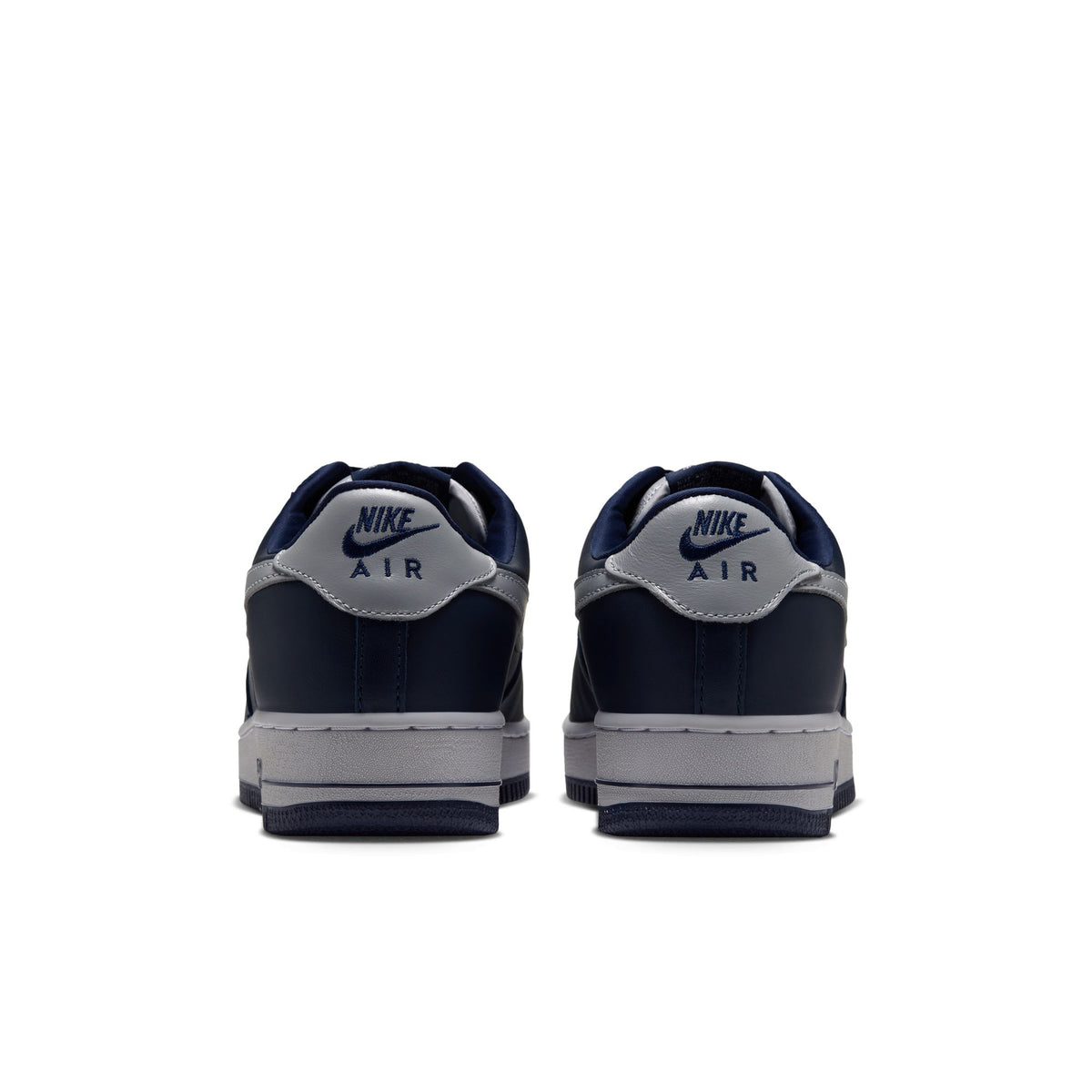 Nike Air Force 1 '01 back view of pair in College Navy/Lt Smoke Grey with Nike Air logo on grey heel tabs