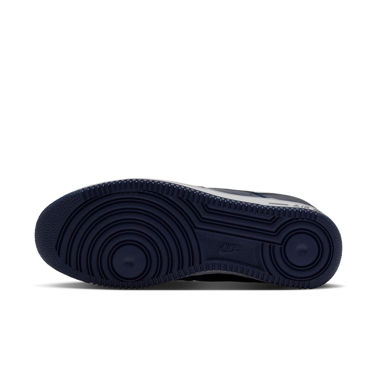 Nike Air Force 1 '01 sole view showing College Navy rubber outsole with concentric circle tread pattern
