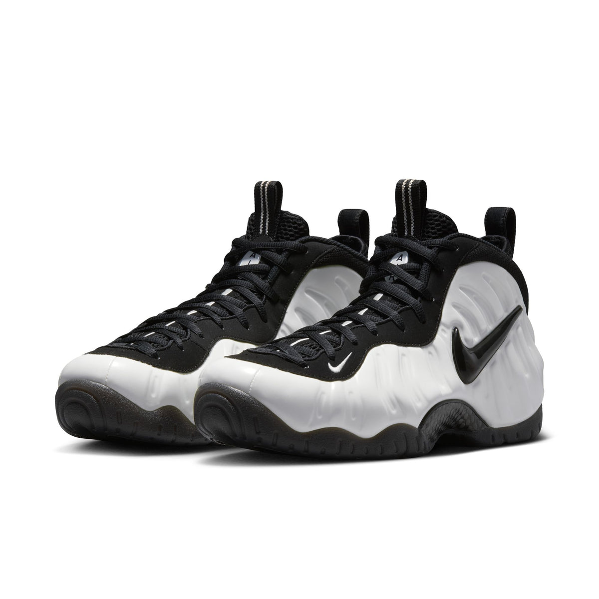 Nike Air Foamposite Pro Premium pair, front angle, Summit White molded shell with black suede upper, laces and Swoosh