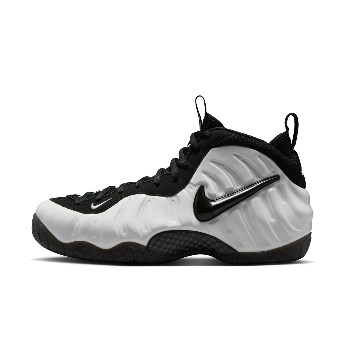 Nike Air Foamposite Pro side view, Summit White molded upper with black Swoosh, black collar and laces
