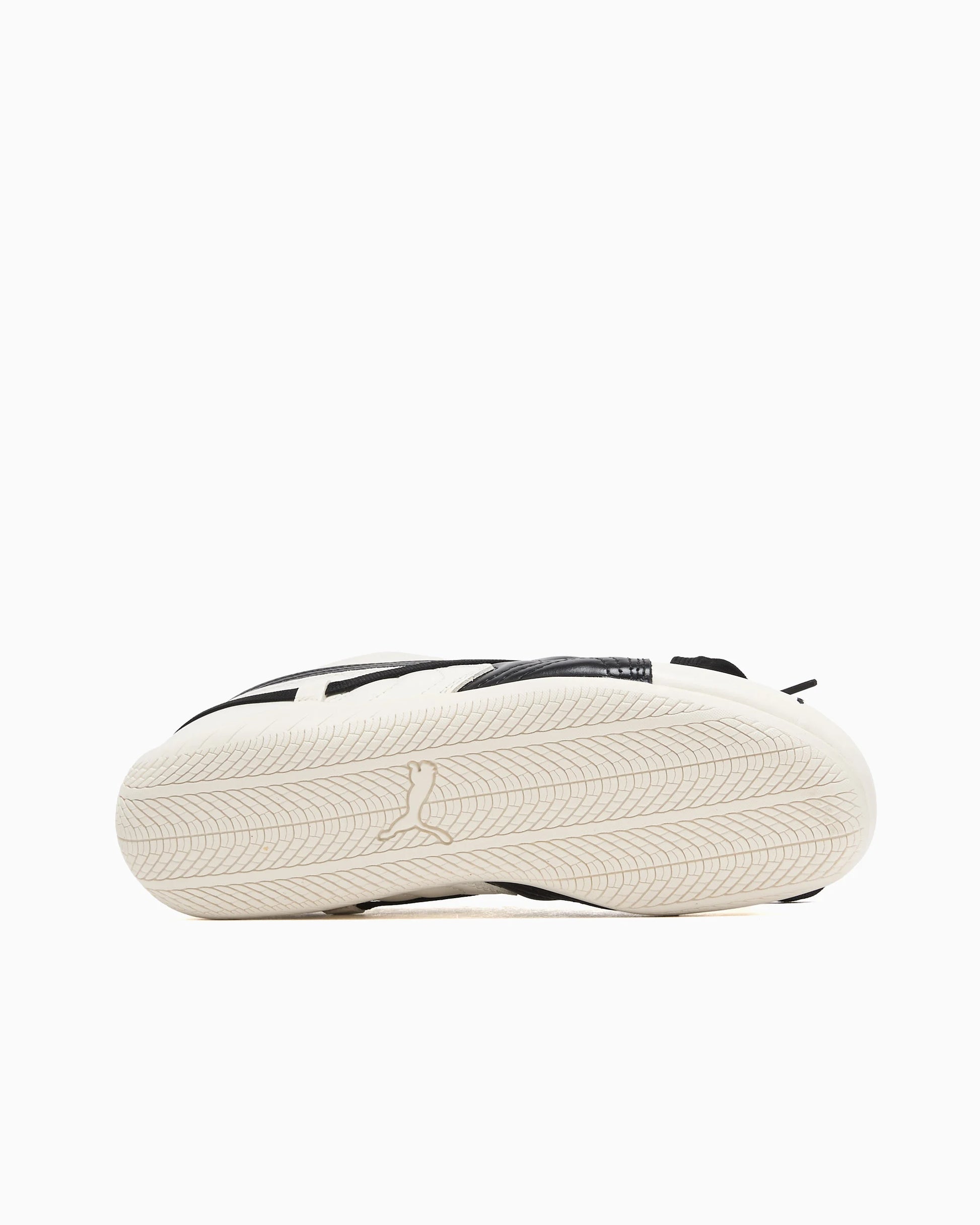 Tire inspired sole shot of the Puma sneaker with a white backdrop.