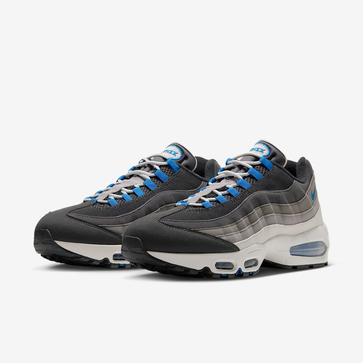 Nike Air Max 95 Big Bubble pair, angled front view in Anthracite with Blue Spark eyelets and gray gradient panels