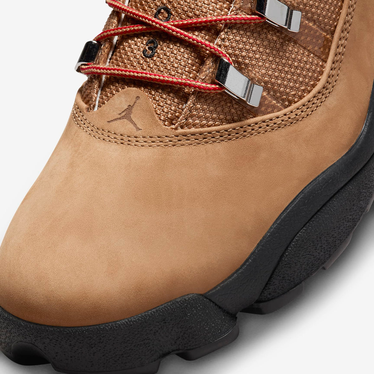 Jordan Winterized 6 Rings toe close-up: Rocky Tan nubuck, woven upper, Varsity Red laces, metal eyelets, black sole