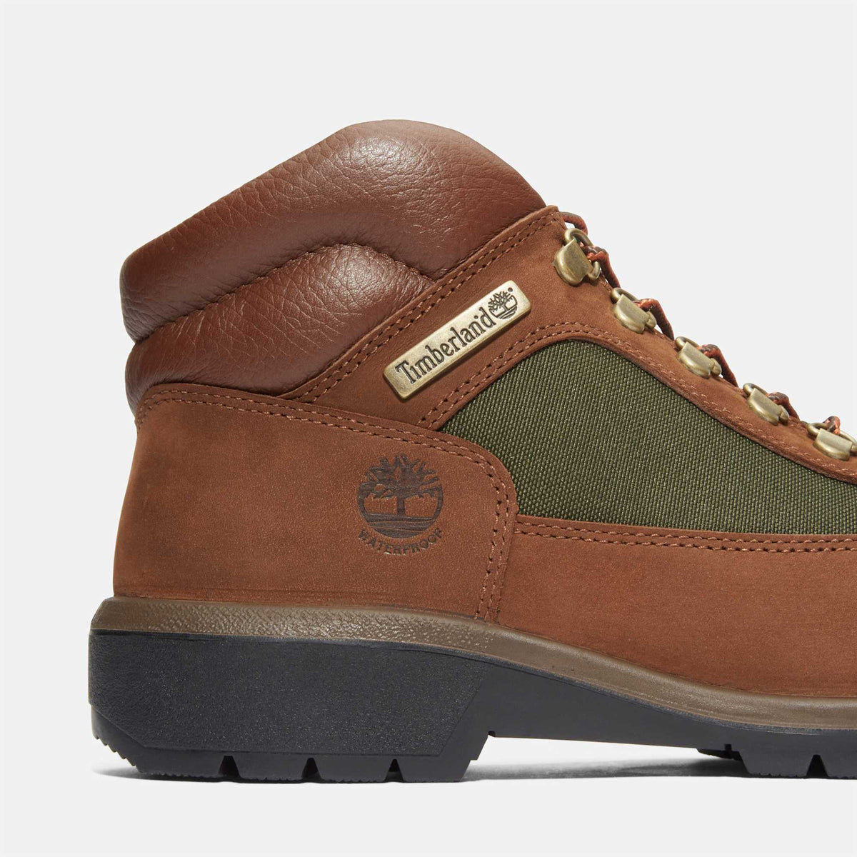 Timberland Field Boot close-up of heel and collar, Dark Brown Nubuck with green canvas panel and metal logo tag